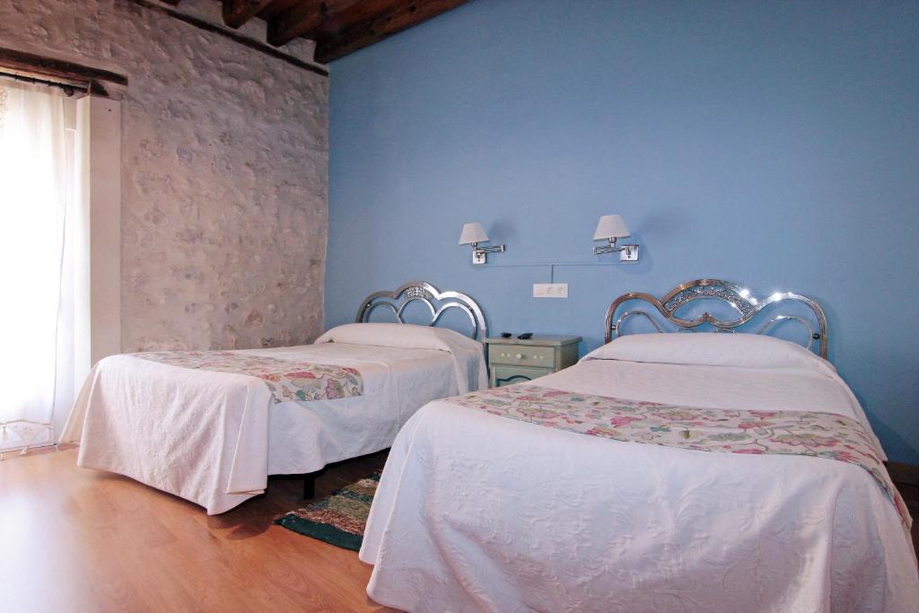 Posteľ alebo postele v izbe v ubytovaní HOTEL RURAL LOS ABUELOS