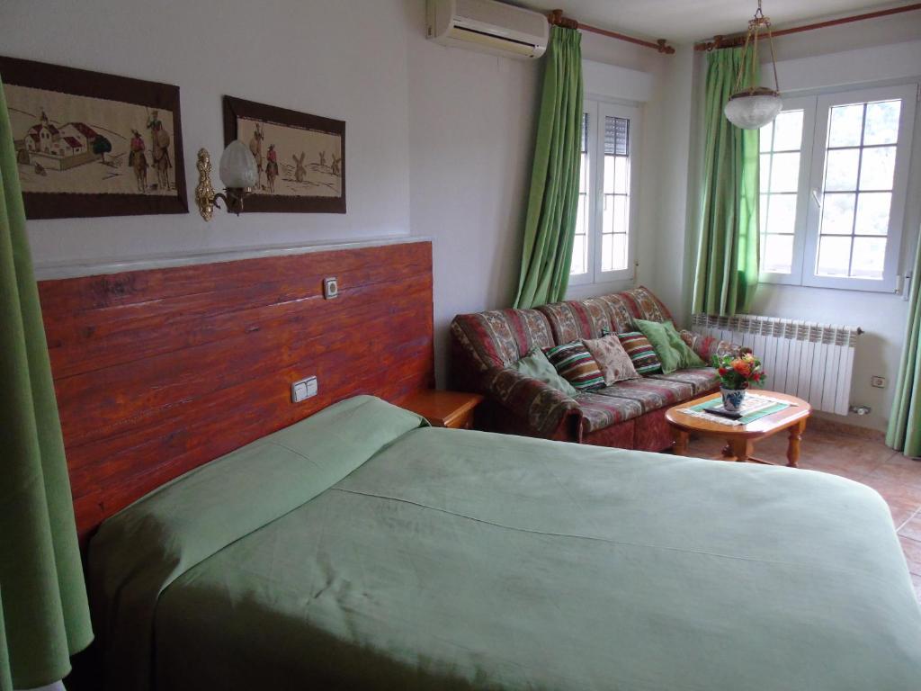 Säng eller sängar i ett rum på Apartamentos Turísticos Cumbres Verdes