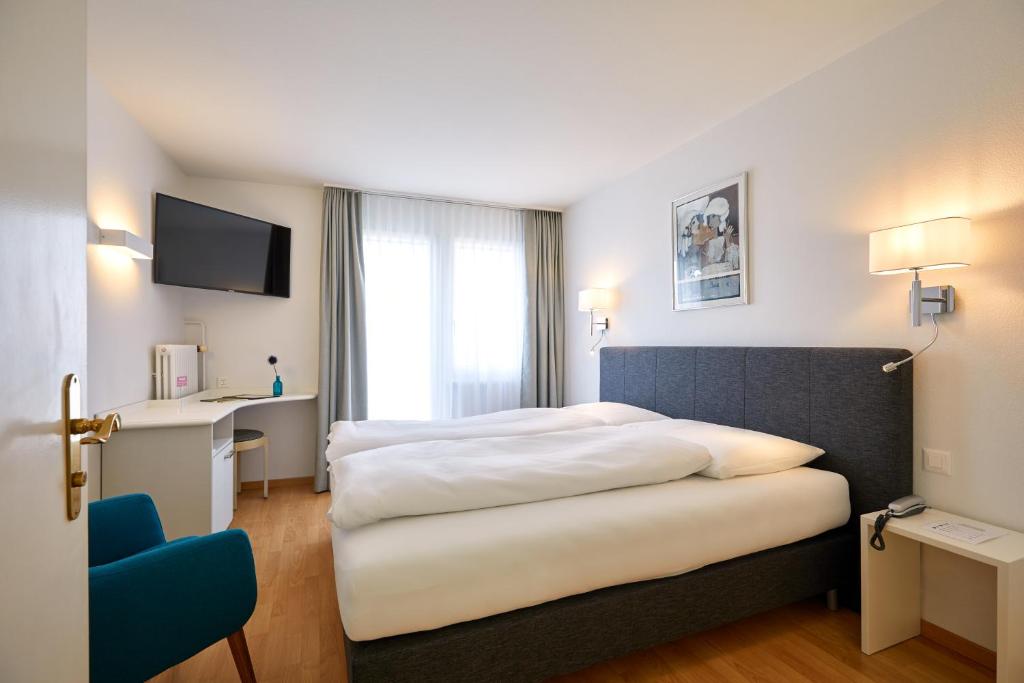 Postel nebo postele na pokoji v ubytování Hotel Schmid & Alfa