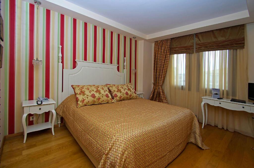 Postel nebo postele na pokoji v ubytování Mediterranean Village Hotel & Spa