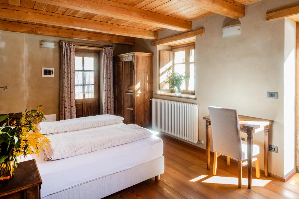 Postel nebo postele na pokoji v ubytování Albergo Locanda Mistral