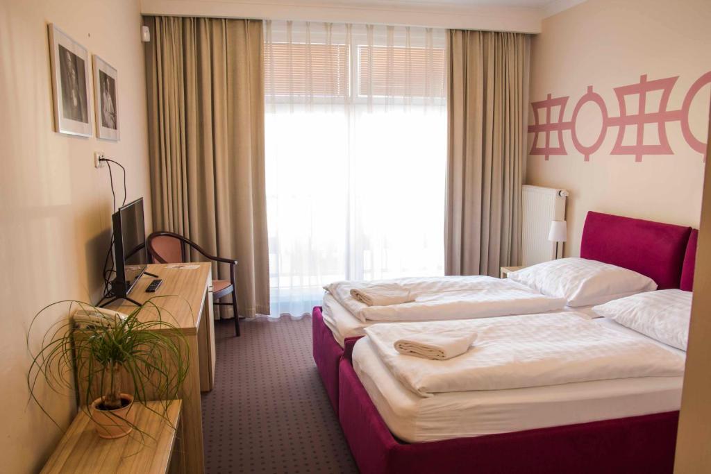 Postel nebo postele na pokoji v ubytování Mini Hotel Akord