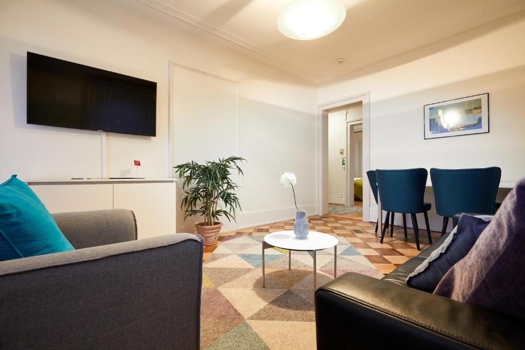 TV a/nebo společenská místnost v ubytování Hotel Schmid & Alfa