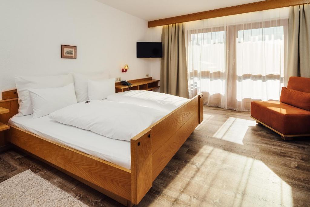 Postel nebo postele na pokoji v ubytování Hotel Komperdell