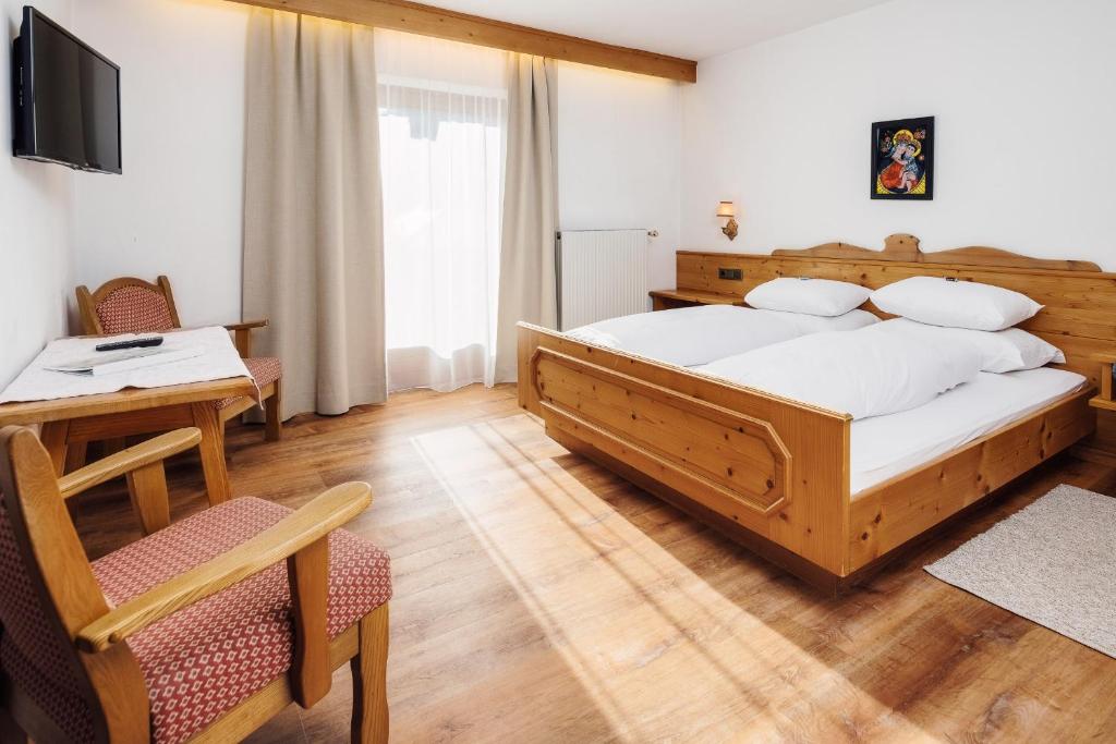 Postel nebo postele na pokoji v ubytování Hotel Komperdell