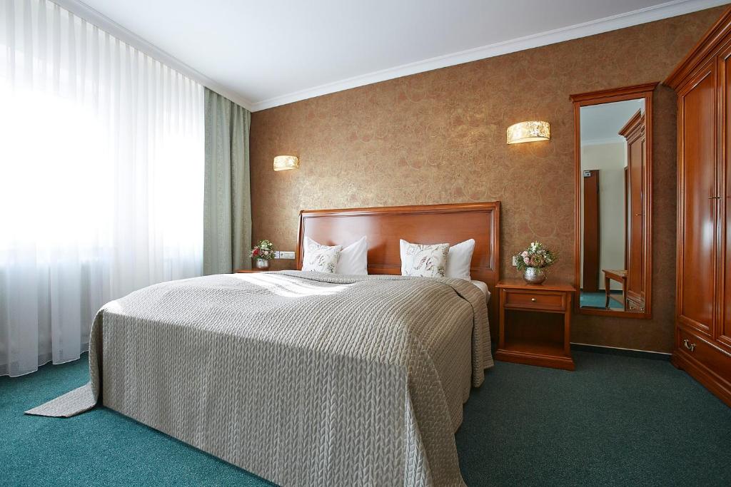 Postel nebo postele na pokoji v ubytování Hotel Beek by Anna