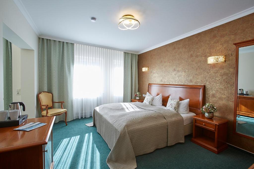 Postel nebo postele na pokoji v ubytování Hotel Beek by Anna