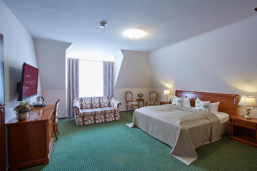 Postel nebo postele na pokoji v ubytování Hotel Beek by Anna