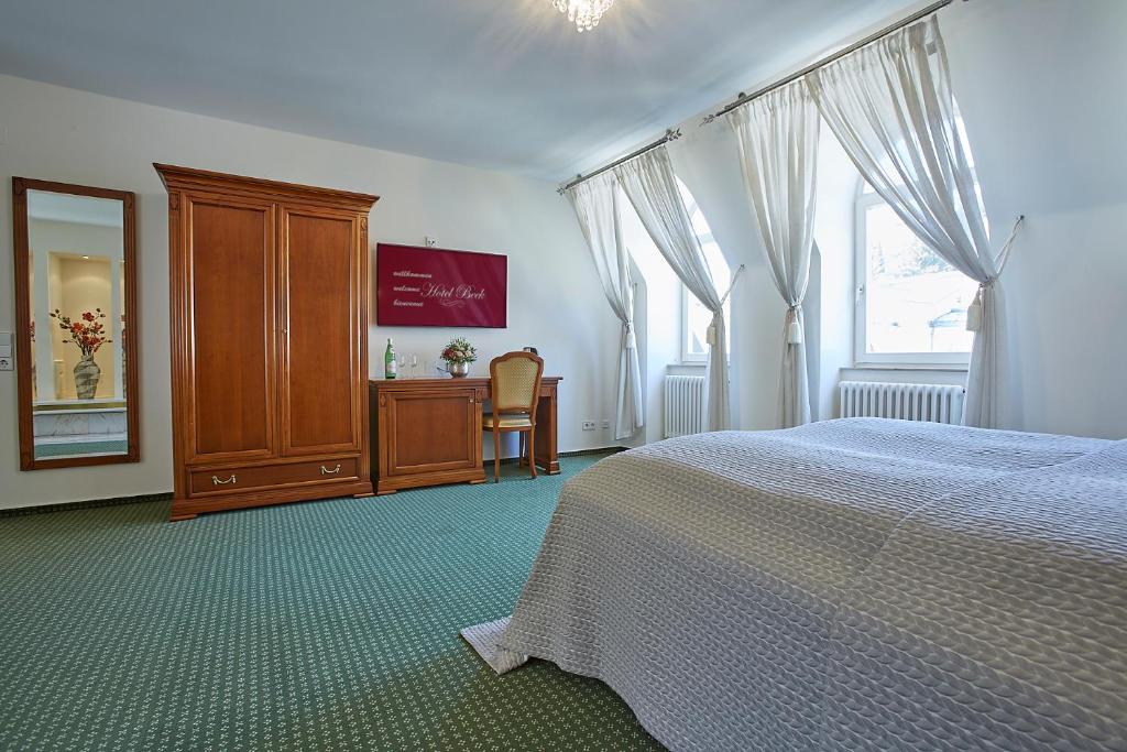 Postel nebo postele na pokoji v ubytování Hotel Beek by Anna
