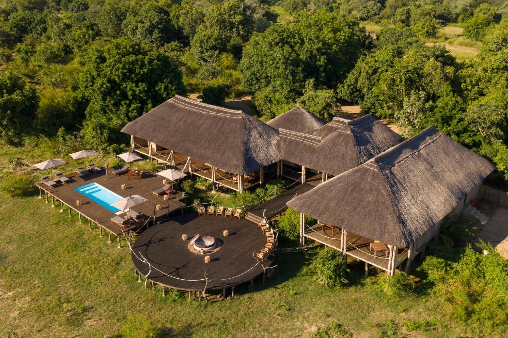 an overhead view of a house with a swimming pool at Chikunto Safari Lodge in Kakumbi