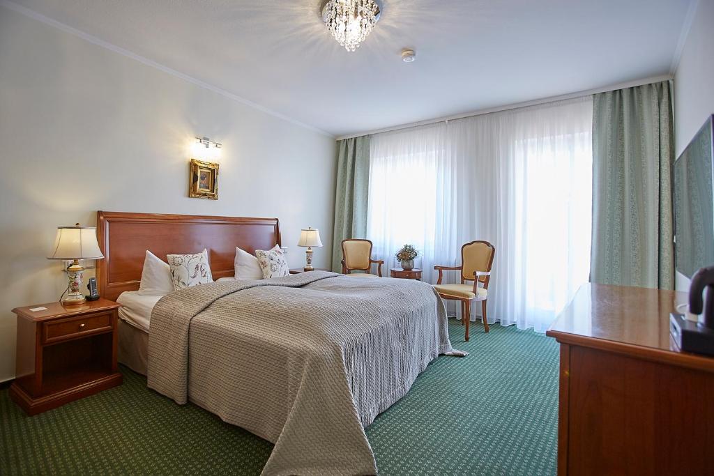 Postel nebo postele na pokoji v ubytování Hotel Beek by Anna