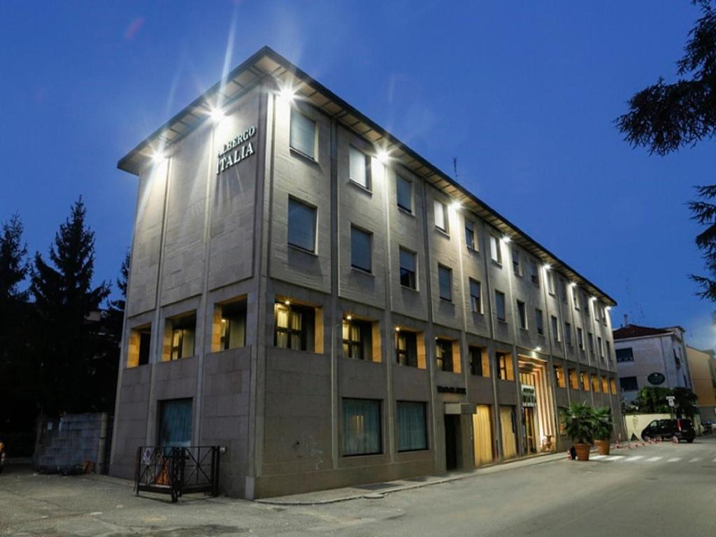 a large building with lights on top of it at Albergo Italia in Novara