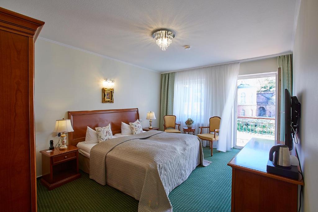 Postel nebo postele na pokoji v ubytování Hotel Beek by Anna