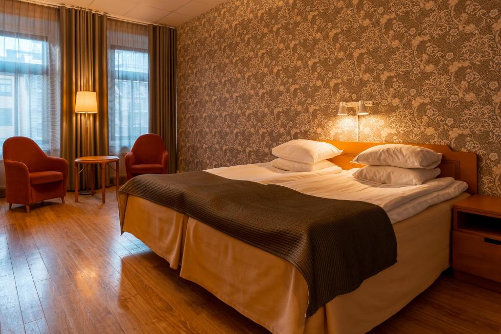 Postel nebo postele na pokoji v ubytování Hotel Lorensberg