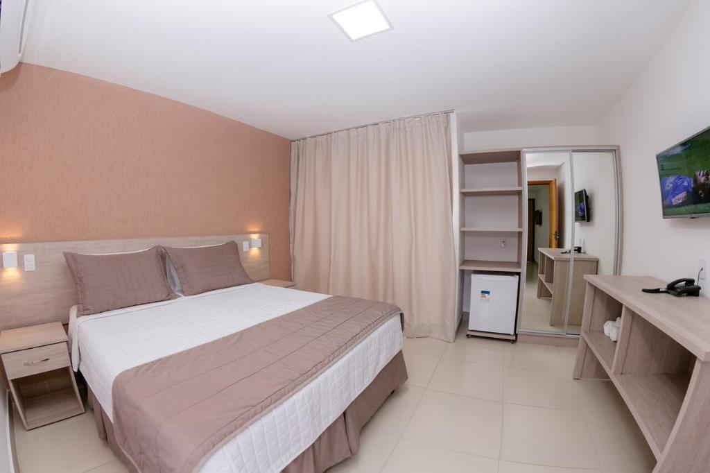 Postel nebo postele na pokoji v ubytování Hotel Fazenda China Park