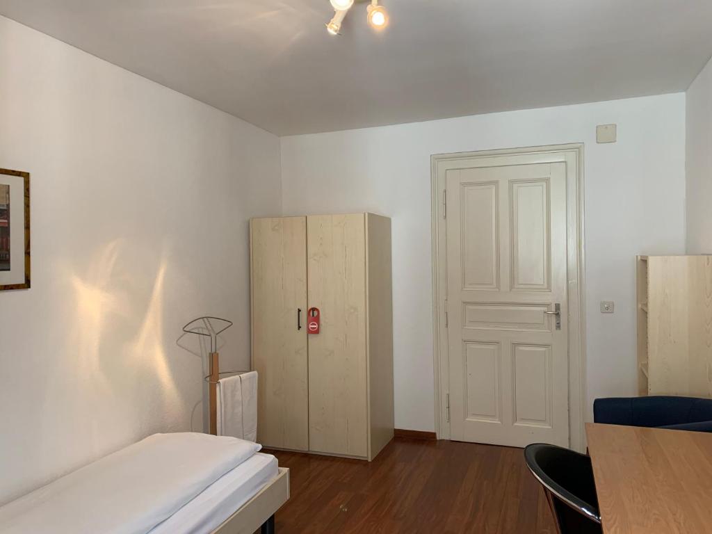 Postel nebo postele na pokoji v ubytování Residence zur Musegg
