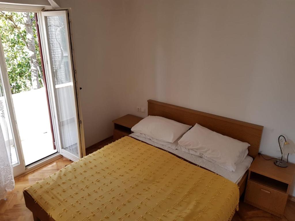 Posteľ alebo postele v izbe v ubytovaní Apartments Ivana Diklo