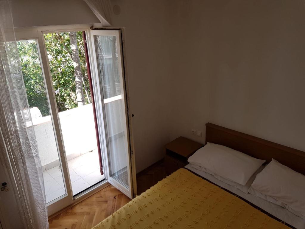 Posteľ alebo postele v izbe v ubytovaní Apartments Ivana Diklo