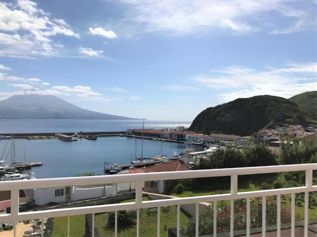 a view of a harbor with boats in the water at Azoris Faial Garden – Resort Hotel in Horta