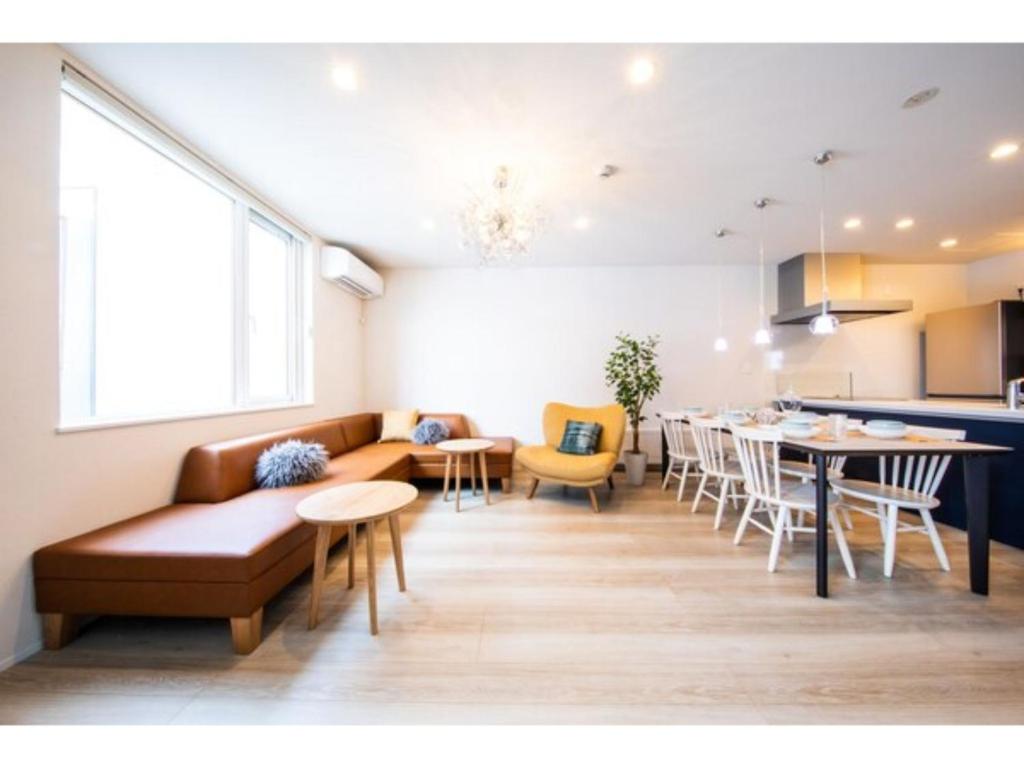 a living room with a couch and a table at Terrace Toyohira / Vacation STAY 81232 in Sapporo