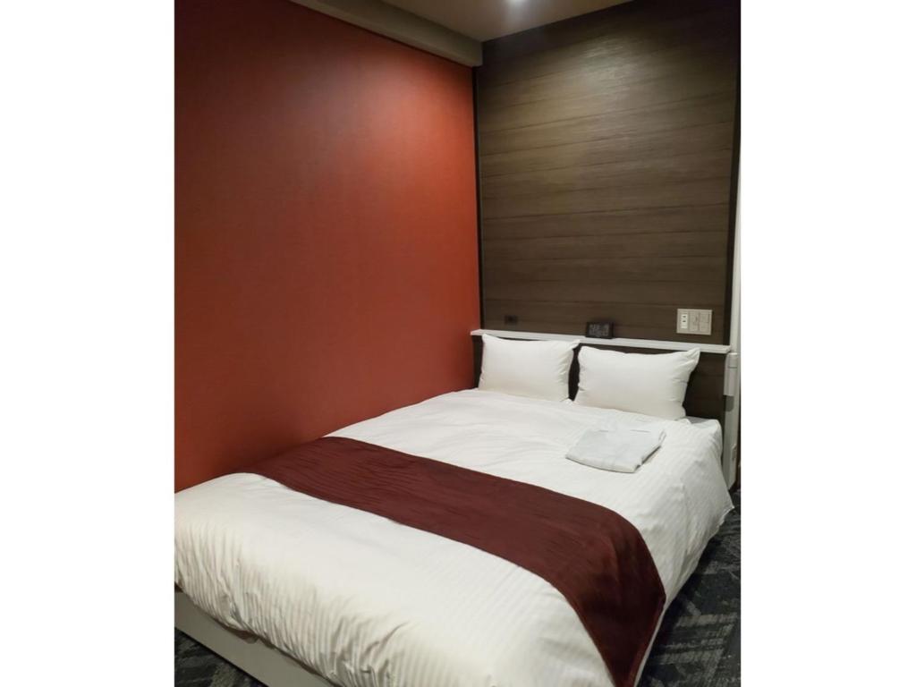 Gulta vai gultas numurā naktsmītnē Hotel Ascent Hamamatsu / Vacation STAY 79774