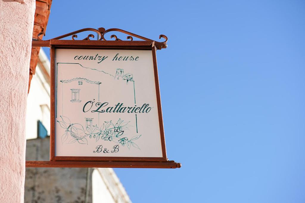 a sign on the side of a building at O' Lattariello in Amalfi