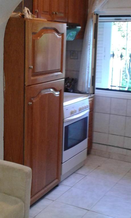 A kitchen or kitchenette at Villa Angela, Traditional Villa in the village