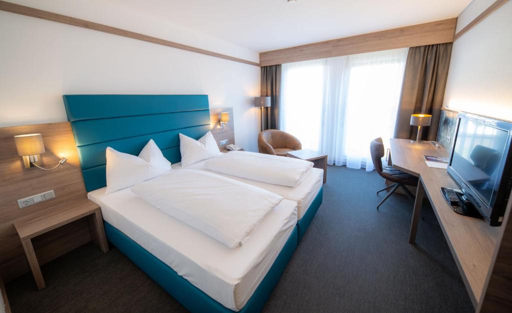 Ein Bett oder Betten in einem Zimmer der Unterkunft Hotel Metropol