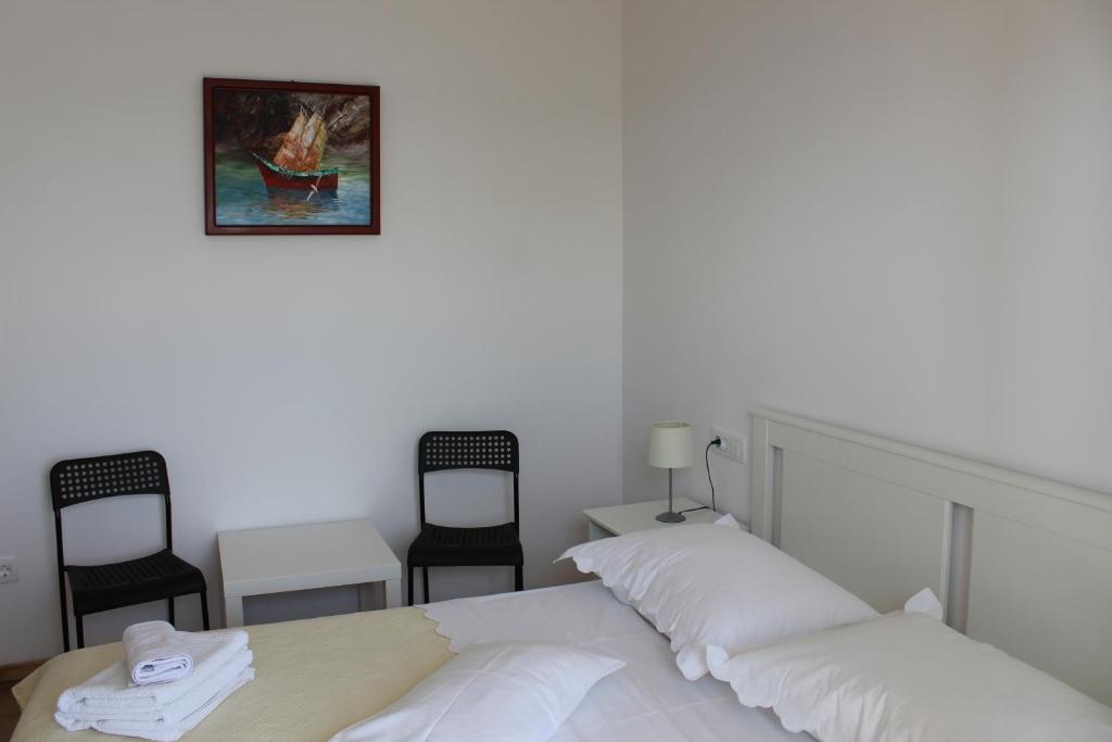 Postel nebo postele na pokoji v ubytování Apartments Tom