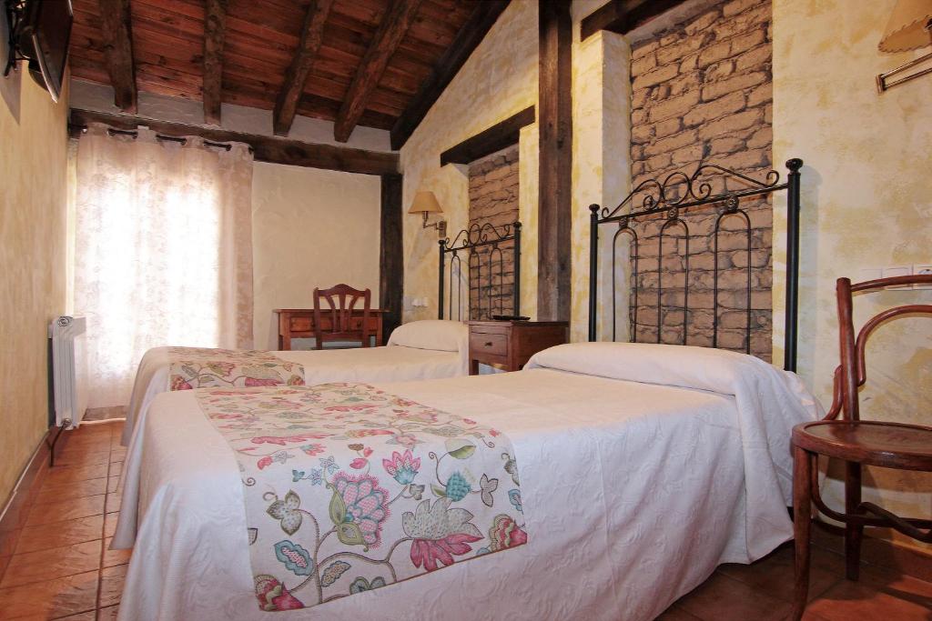 Posteľ alebo postele v izbe v ubytovaní HOTEL RURAL LOS ABUELOS