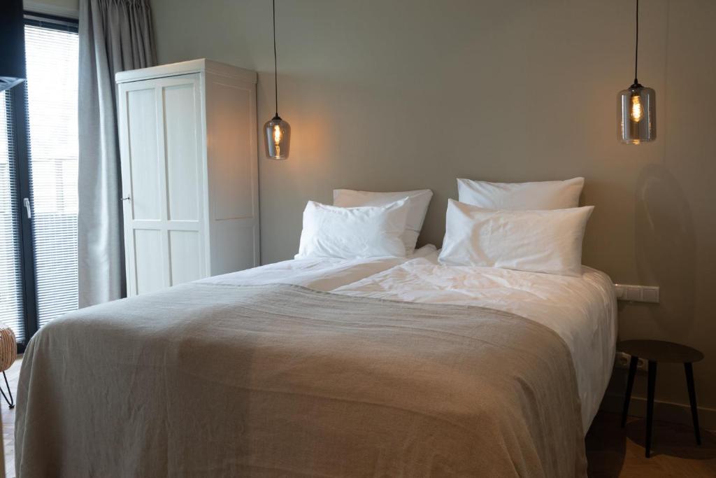 Postel nebo postele na pokoji v ubytování Parkhotel Abcoude