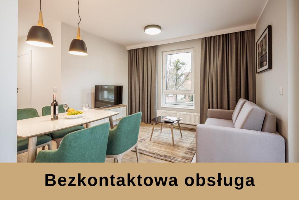 Televízia a/alebo spoločenská miestnosť v ubytovaní Marina Apartments ZOO
