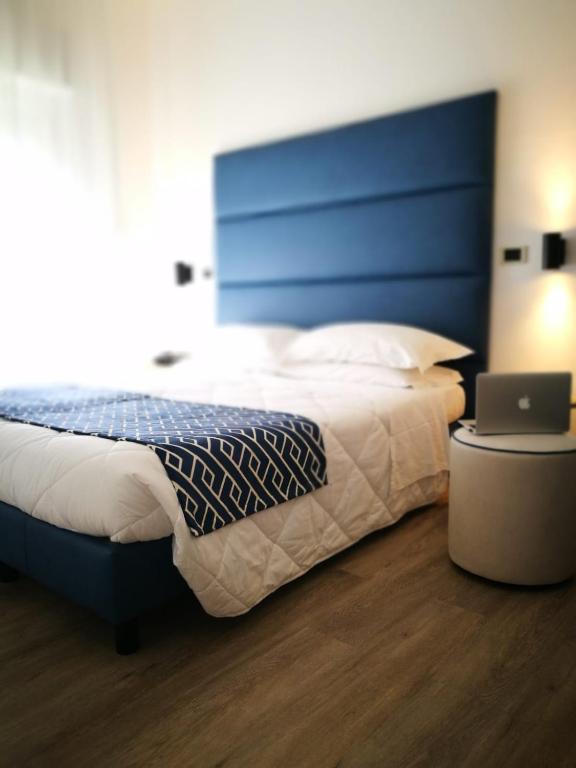 Postel nebo postele na pokoji v ubytování Hotel Rombino