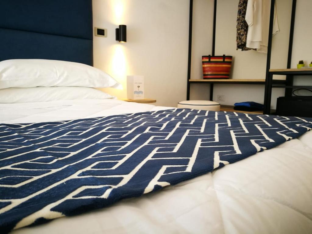 Postel nebo postele na pokoji v ubytování Hotel Rombino
