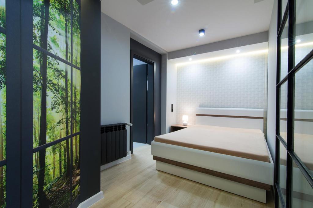 Posteľ alebo postele v izbe v ubytovaní Apartament Przytulny