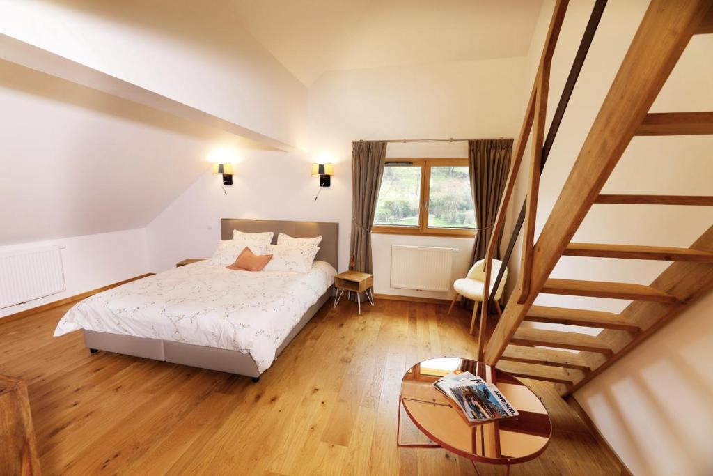 Postel nebo postele na pokoji v ubytování Maison d'hôtes & SPA La Scierie