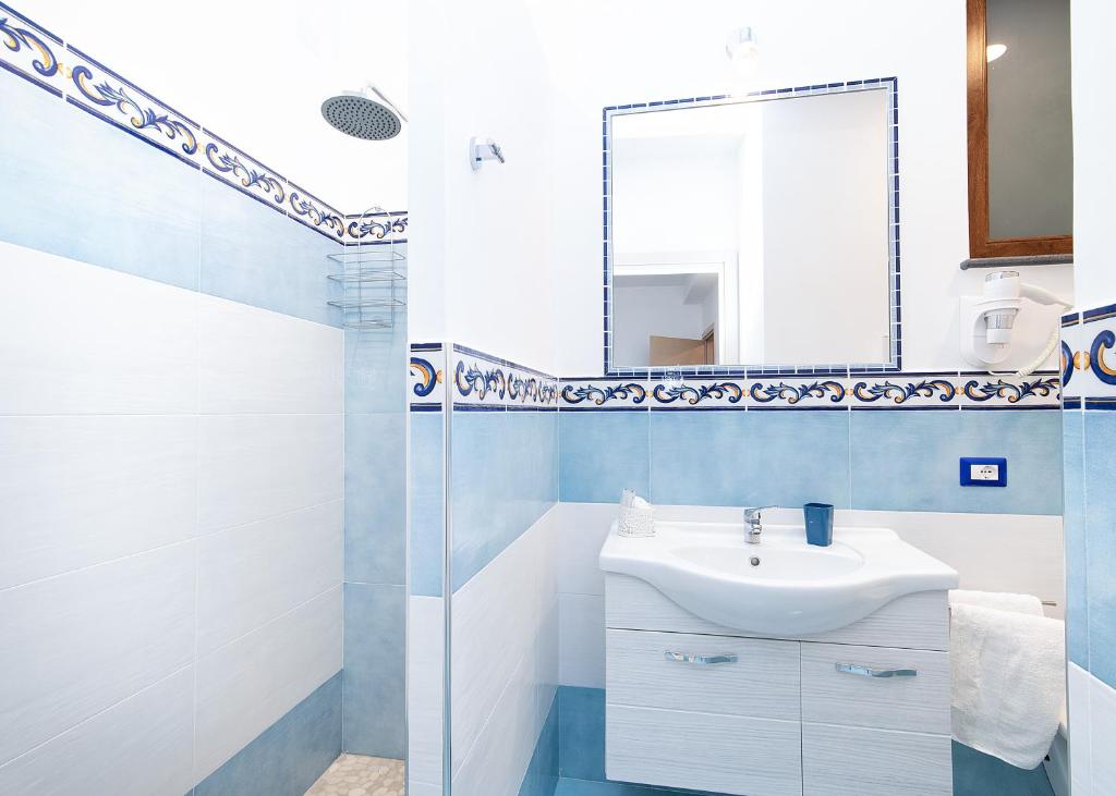 a bathroom with a sink and a mirror at O' Lattariello in Amalfi