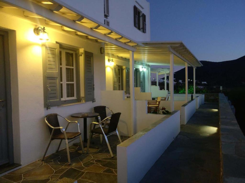 a balcony of a house with chairs and a table at Margarita Karidi in Apollonia