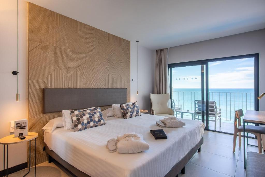 Cama o camas de una habitación en Hotel Cap Negret