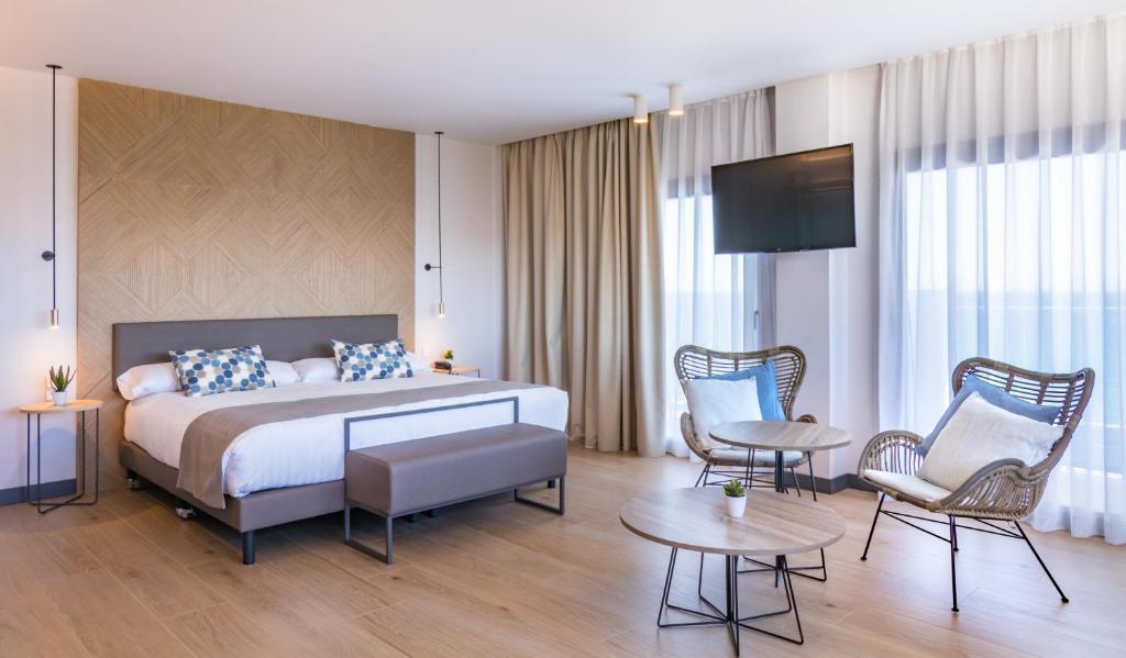 Cama o camas de una habitación en Hotel Cap Negret