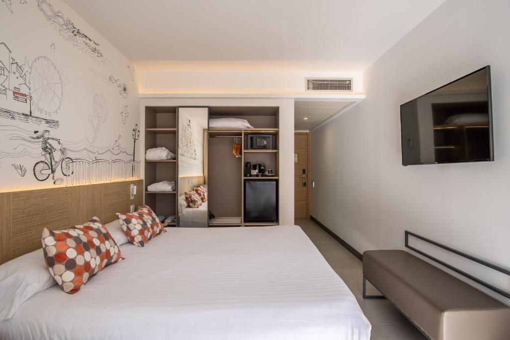 Cama o camas de una habitación en Hotel Cap Negret