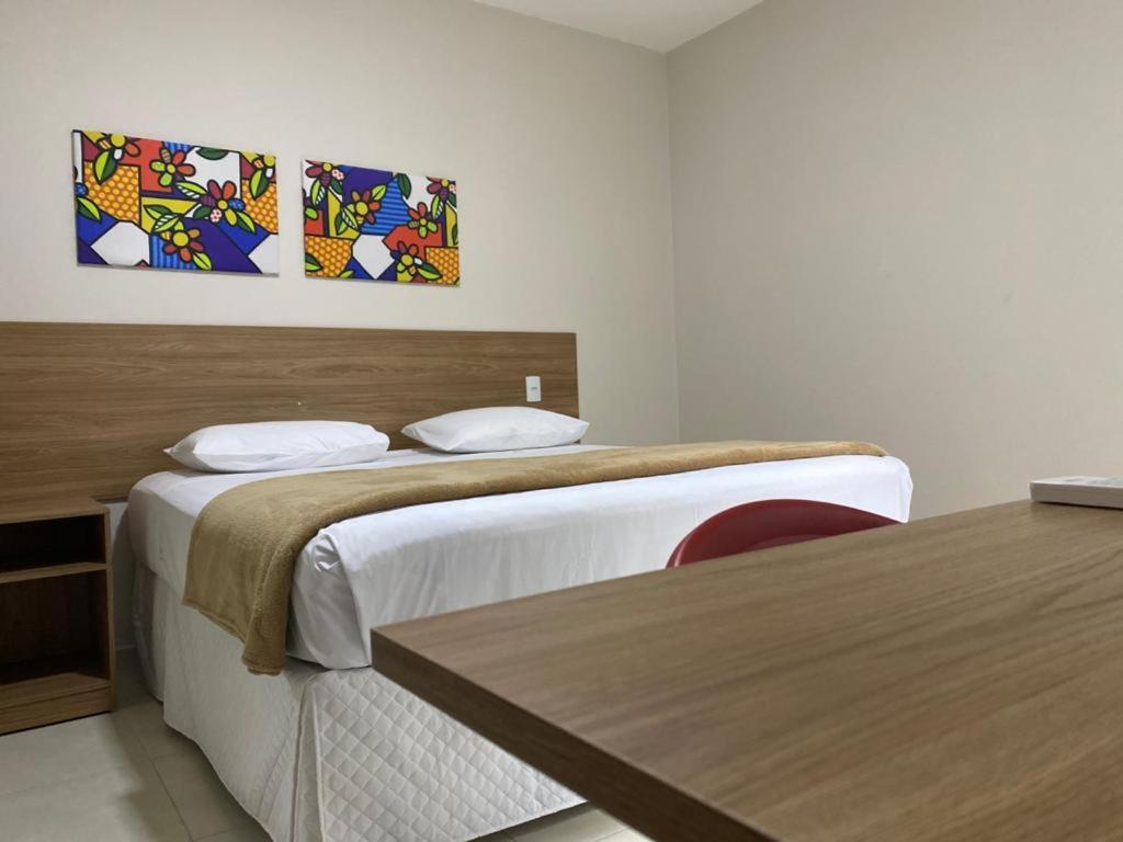 Postel nebo postele na pokoji v ubytování Hotel QualitySul