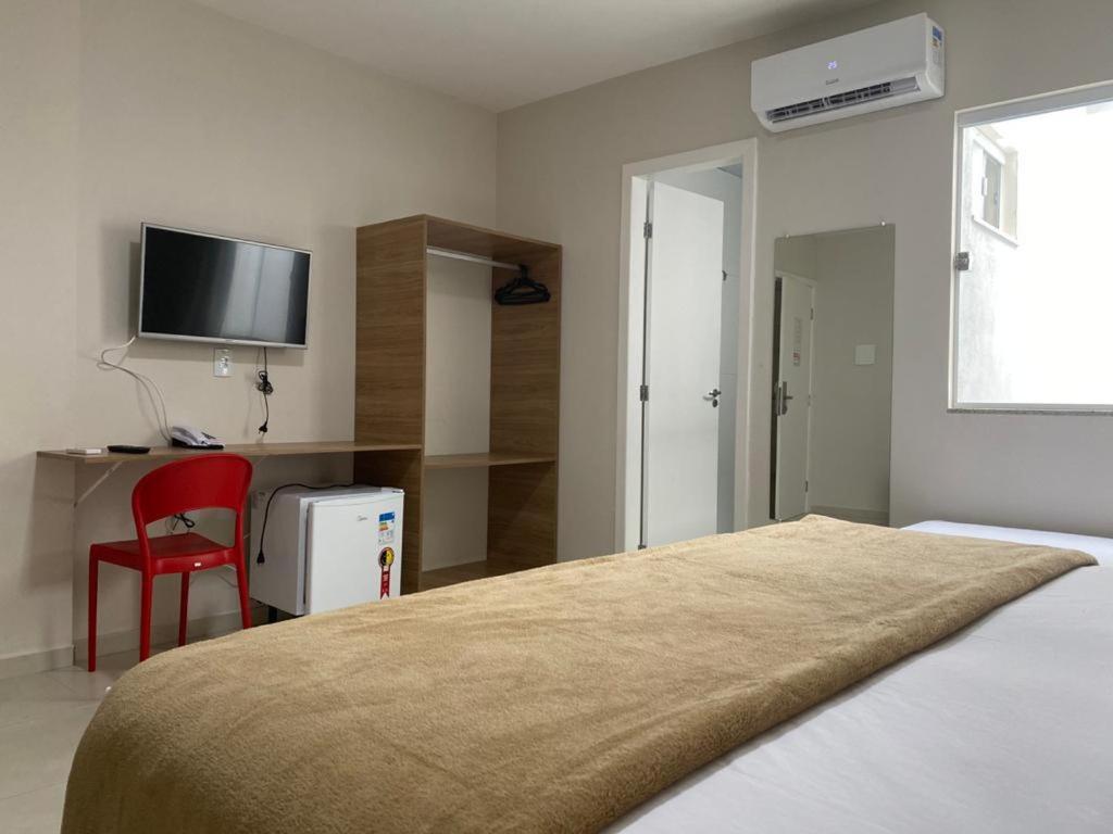 Postel nebo postele na pokoji v ubytování Hotel QualitySul