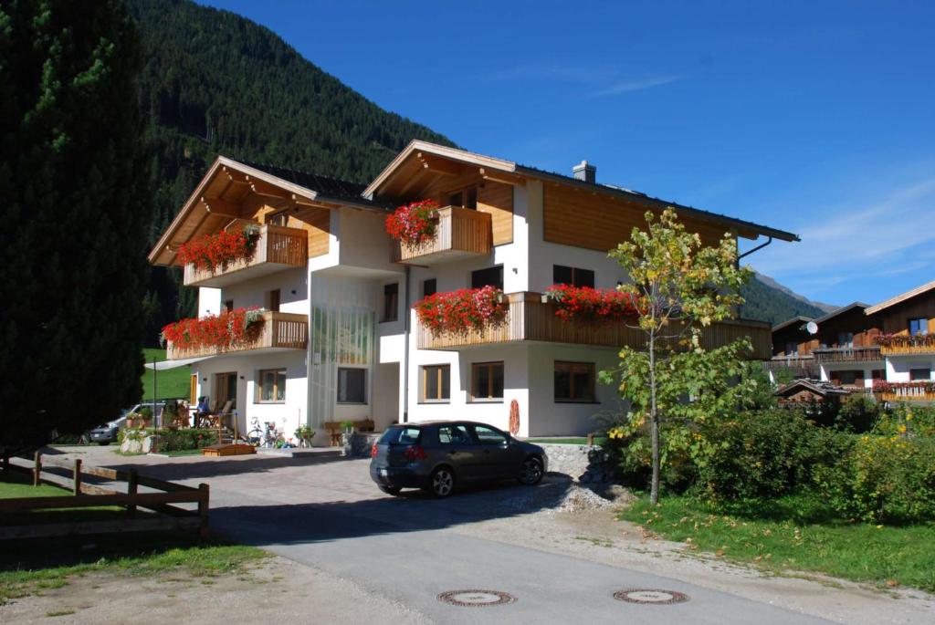 a car parked in front of a building at Haus Kargruber in Santa Maddalena