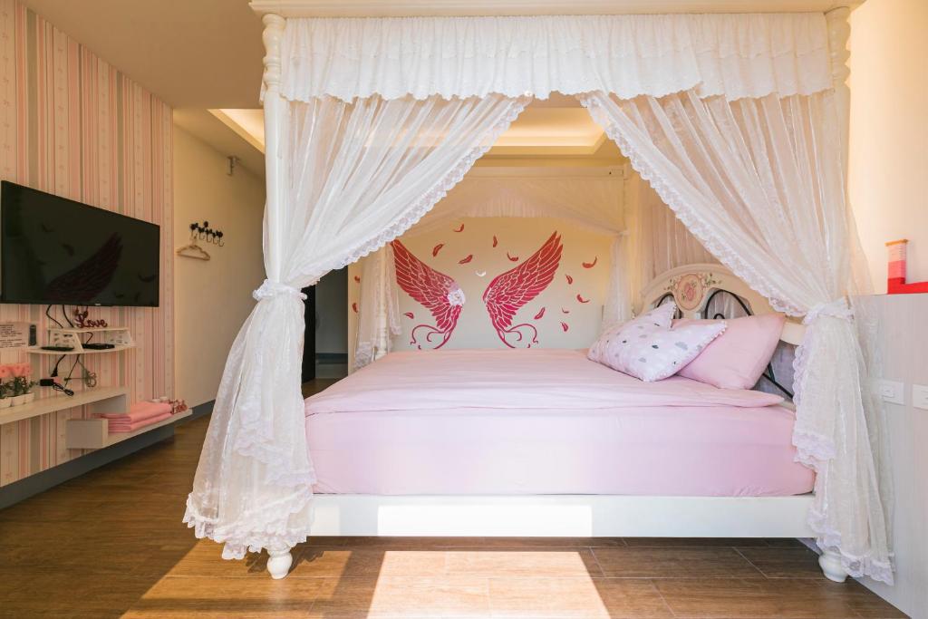 Postel nebo postele na pokoji v ubytování Fun Homestay