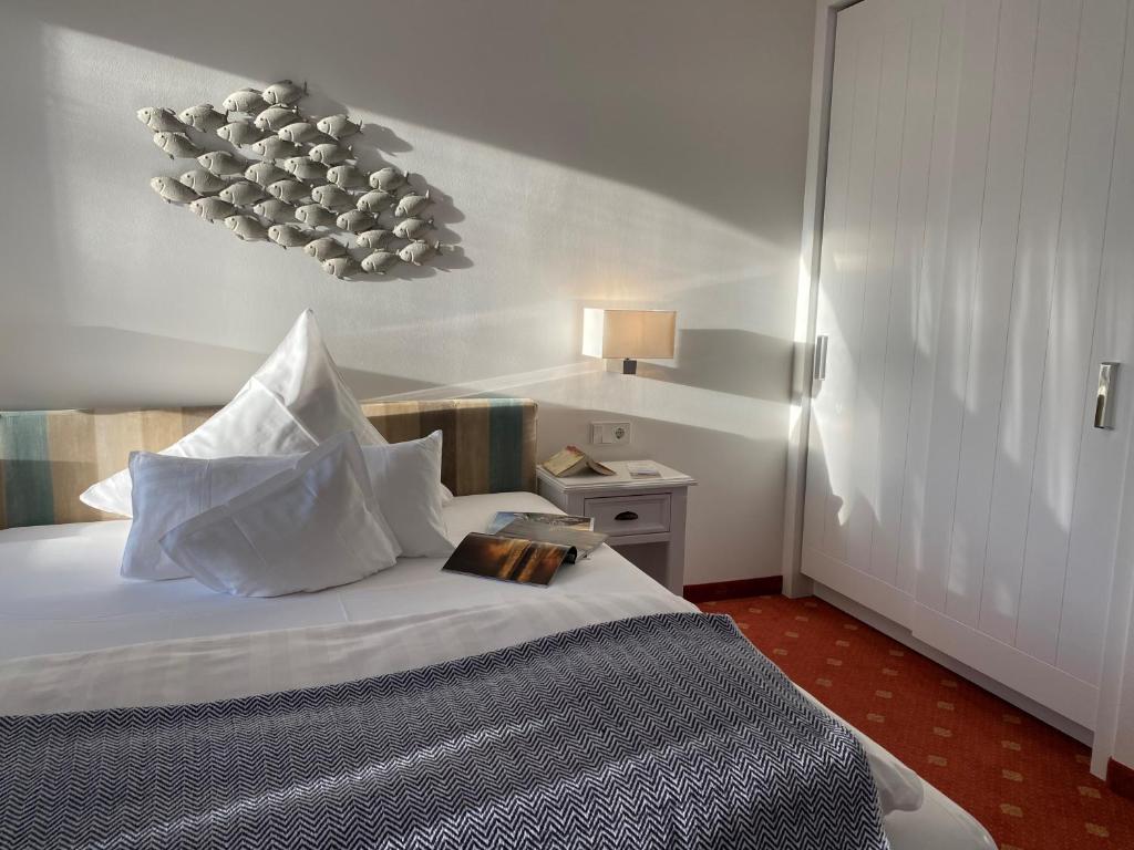 Postel nebo postele na pokoji v ubytování Hotel Wünschmann