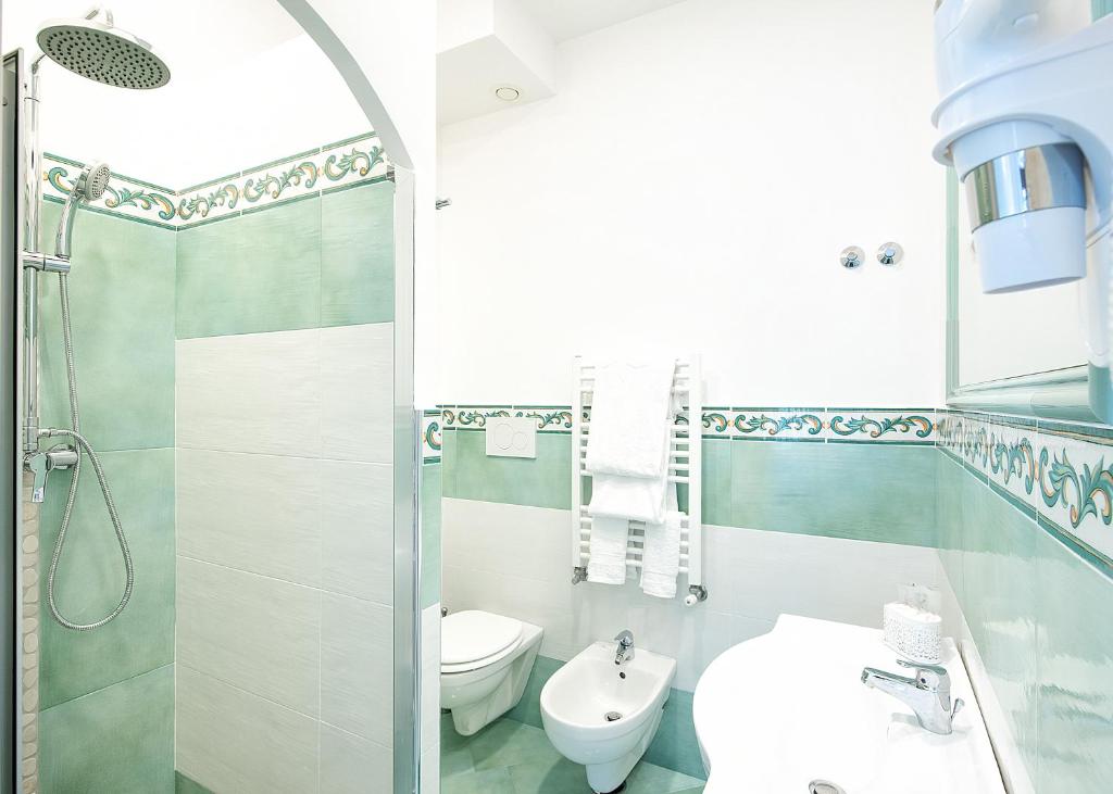 a bathroom with a shower and a toilet and a sink at O' Lattariello in Amalfi