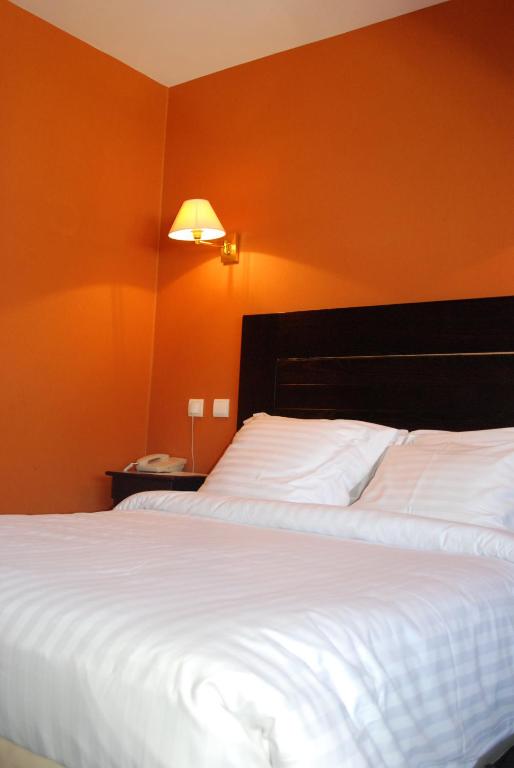 Postel nebo postele na pokoji v ubytování Hôtel Ariane & SPA