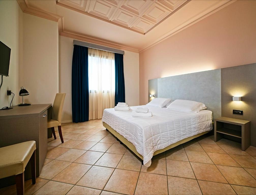 Voodi või voodid majutusasutuse Albergo Papillon toas
