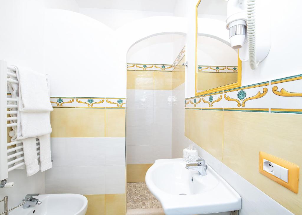 a bathroom with a sink and a mirror at O' Lattariello in Amalfi